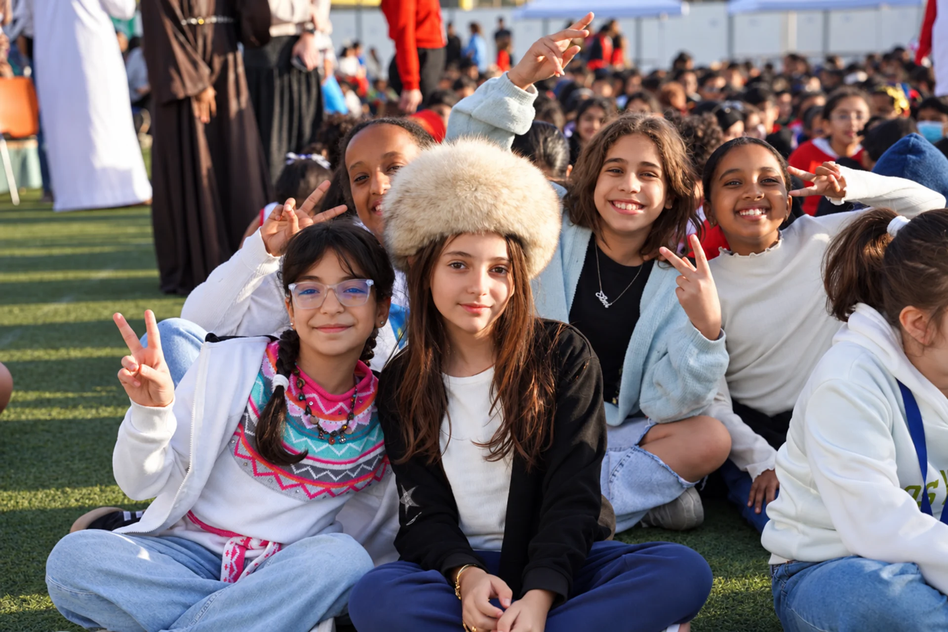 International schools in UAE: smiling students from different backgrounds at a school event