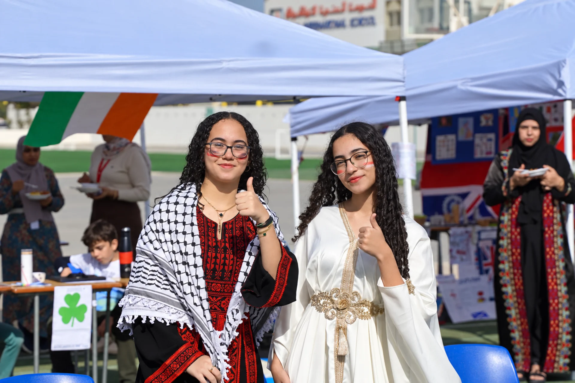 Private education in Dubai: students in traditional dress at an international day event