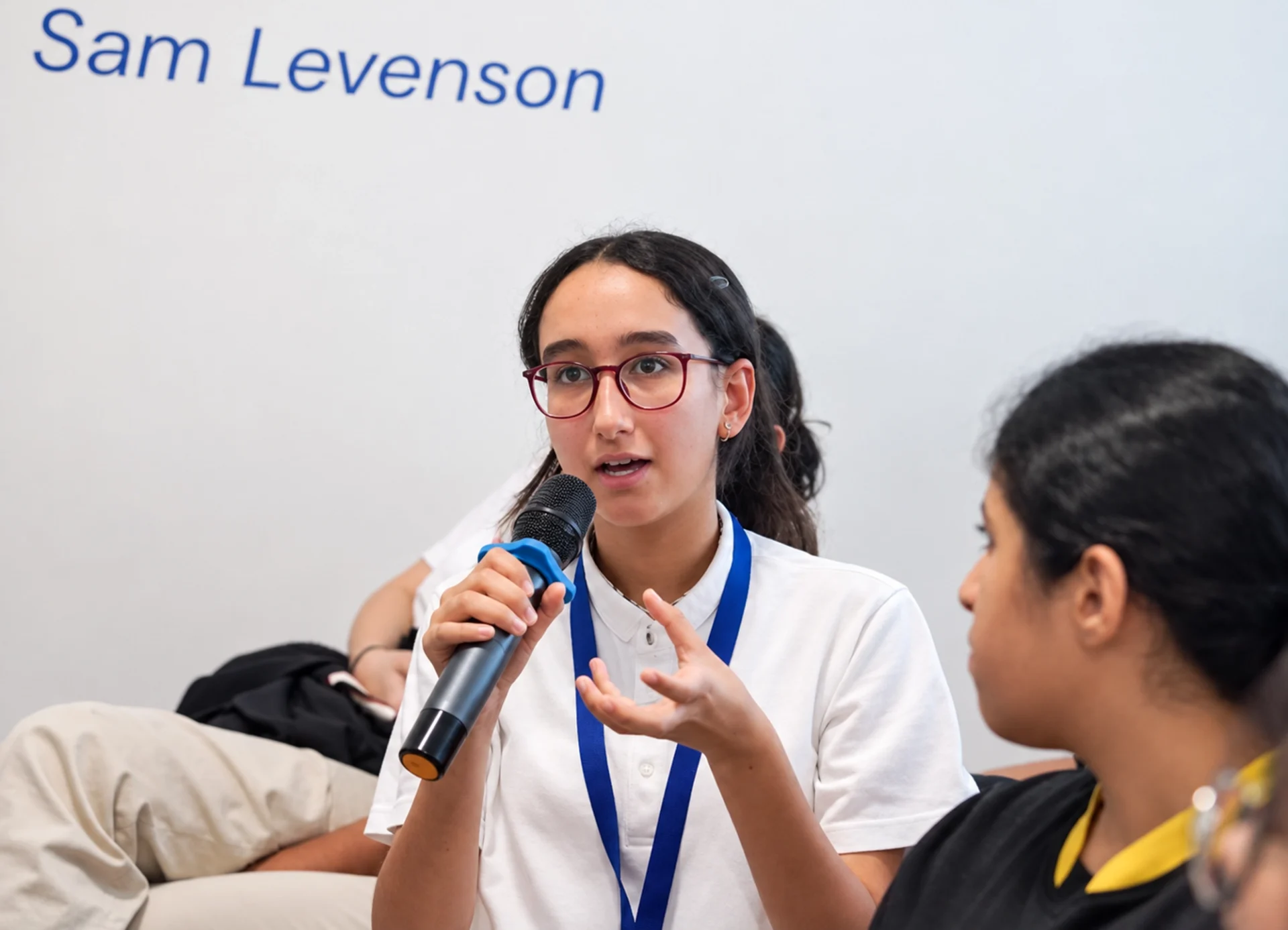 High Performance Learning in UAE: student speaking during a class discussion