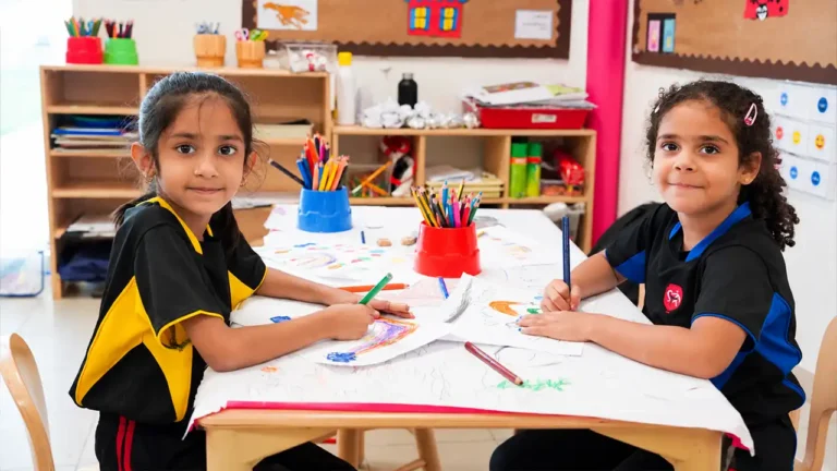 British curriculum exams: young students drawing at a classroom table