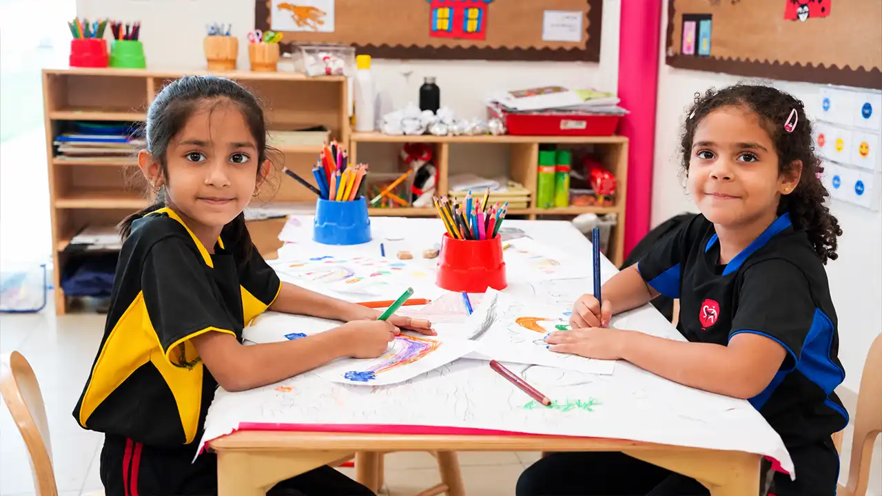 British curriculum exams: young students drawing at a classroom table